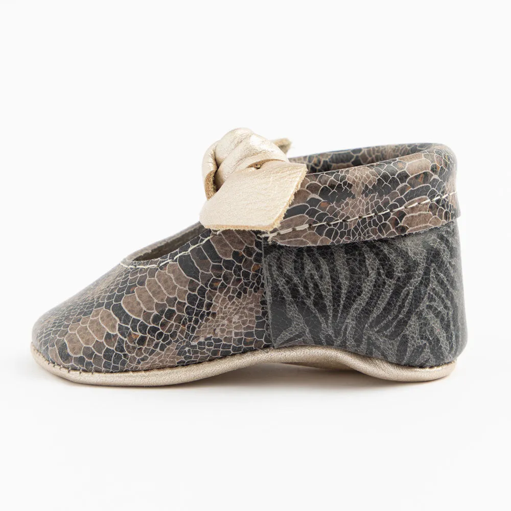 Freshly Picked Platinum Snakeskin Knotted Bow Mini Sole