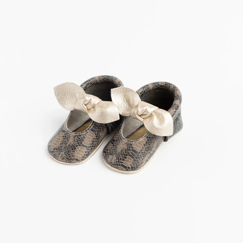 Freshly Picked Platinum Snakeskin Knotted Bow Mini Sole