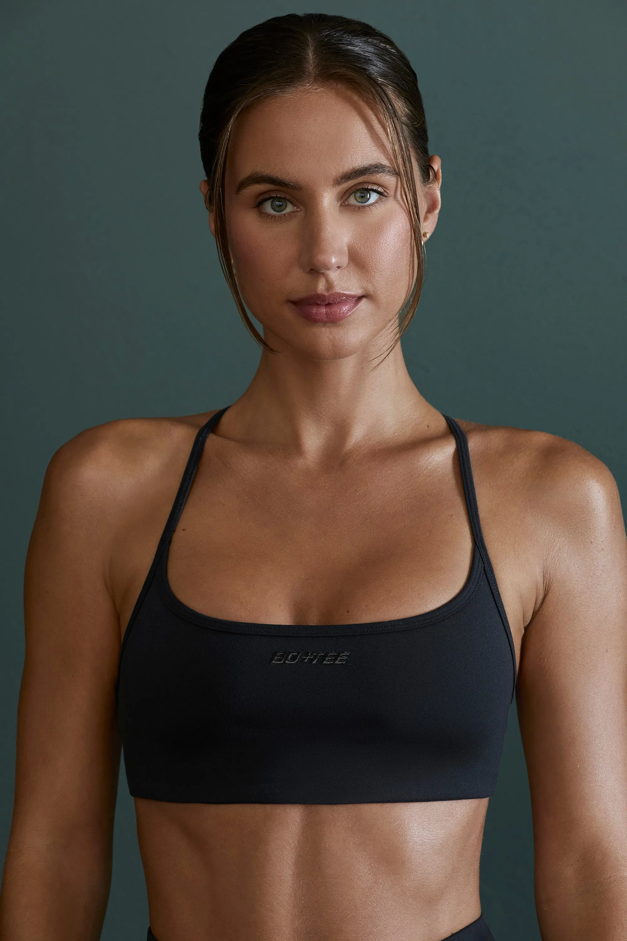 Scoop Neck Open Back Sports Bra in Black